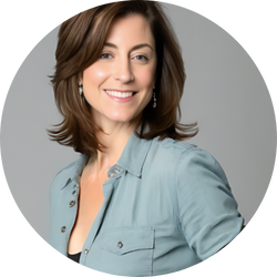 Jacqueline Levine, jewelry designer for The Crowns, smiling in a light blue shirt.