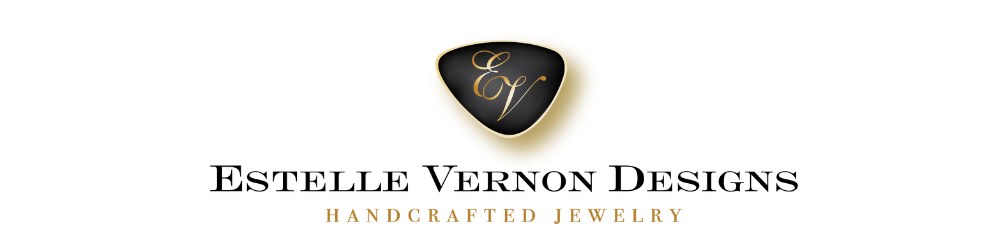 Estelle Vernon handcrafted jewelry logo with elegant gold shield
